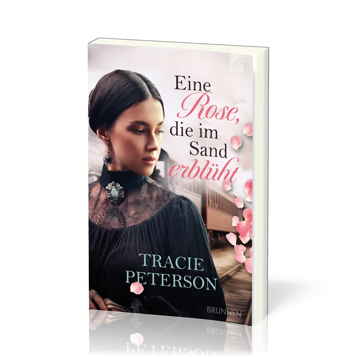 Eine Rose, die im Sand erblüht